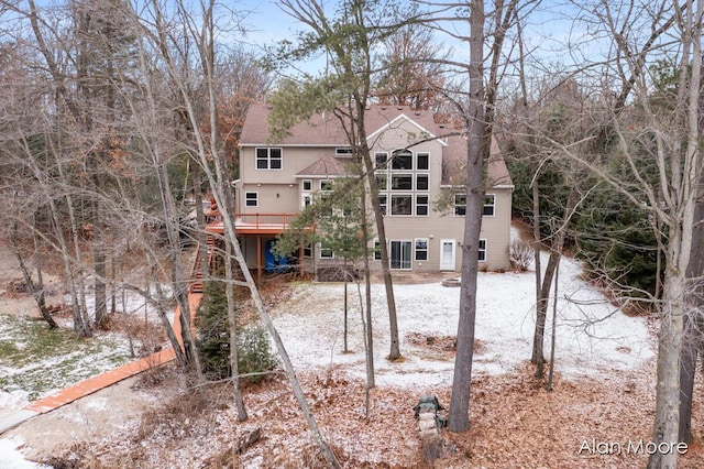 view of snow covered house