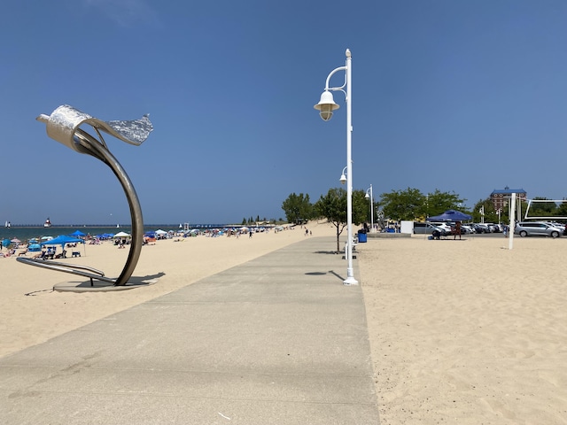 exterior space with a beach view and a water view