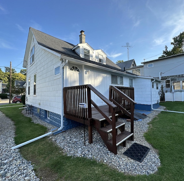 back of house featuring a yard