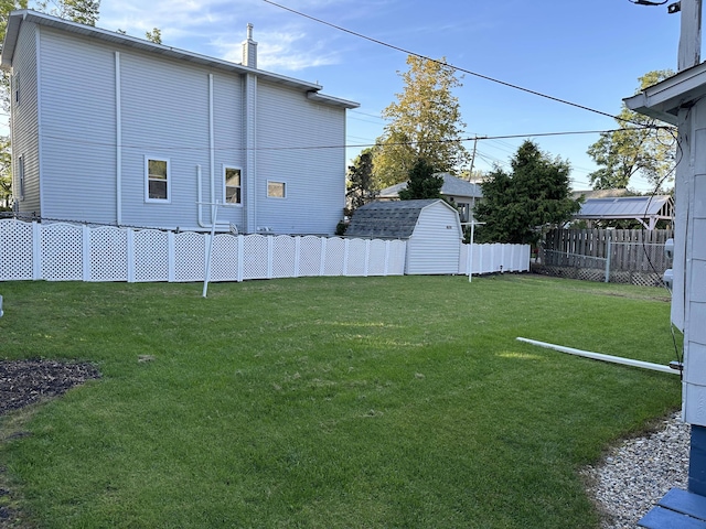 view of yard with a storage shed