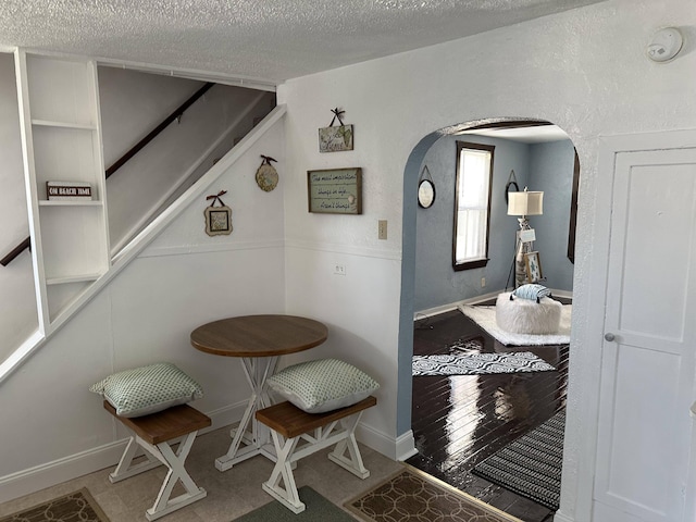 interior space featuring a textured ceiling