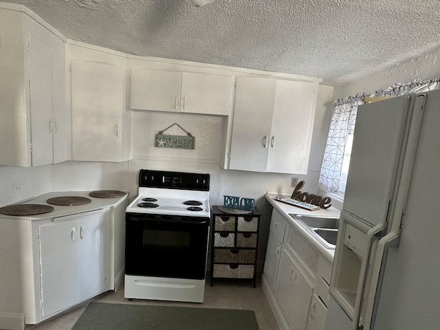 kitchen with a textured ceiling, sink, white cabinets, and white appliances