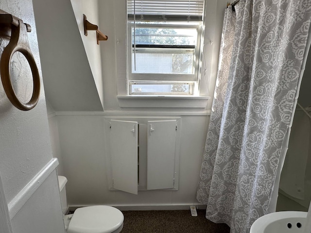 bathroom featuring toilet