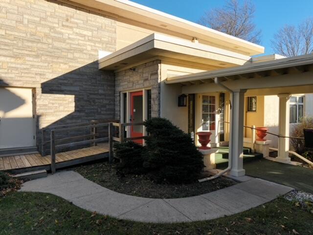 entrance to property with a wooden deck