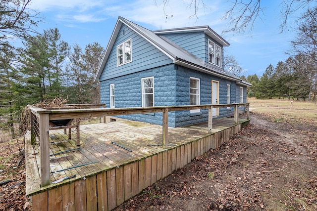 exterior space featuring a wooden deck