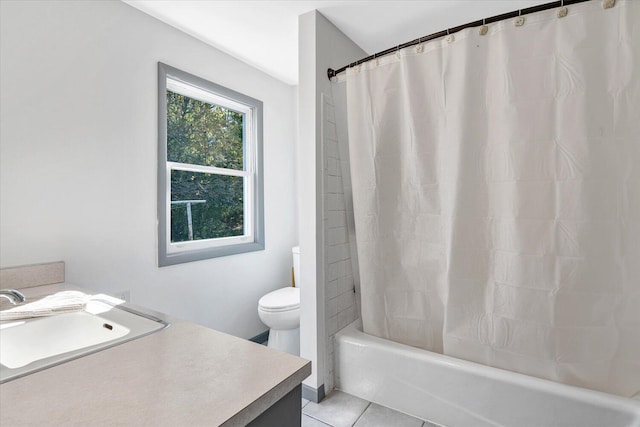 full bathroom featuring toilet, tile patterned flooring, vanity, and shower / tub combo with curtain