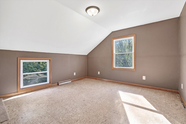 bonus room featuring a baseboard radiator and vaulted ceiling