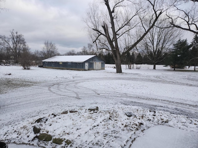 snowy yard with an outdoor structure