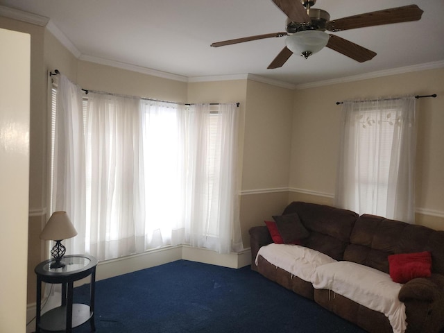 carpeted living room with ornamental molding, ceiling fan, and a healthy amount of sunlight