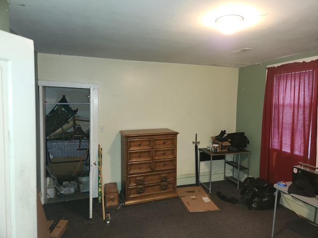 miscellaneous room featuring dark carpet