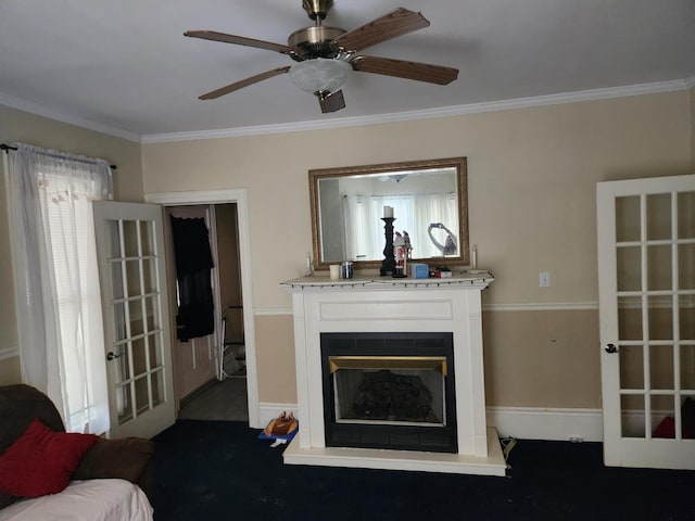 living room with ceiling fan and ornamental molding