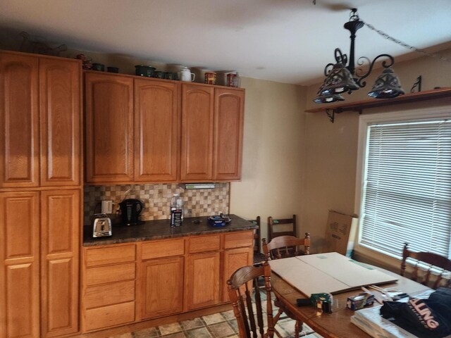 kitchen featuring decorative backsplash and a wealth of natural light