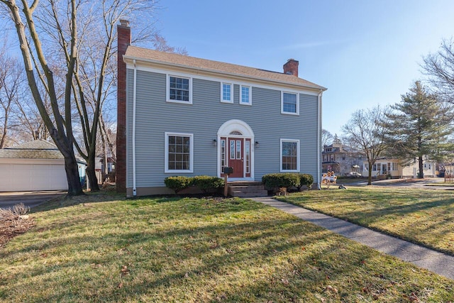 colonial inspired home featuring a front yard