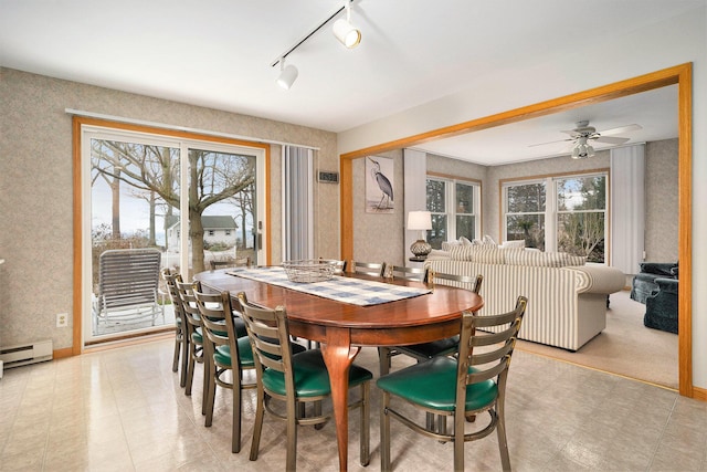 dining space featuring a baseboard radiator, plenty of natural light, and ceiling fan