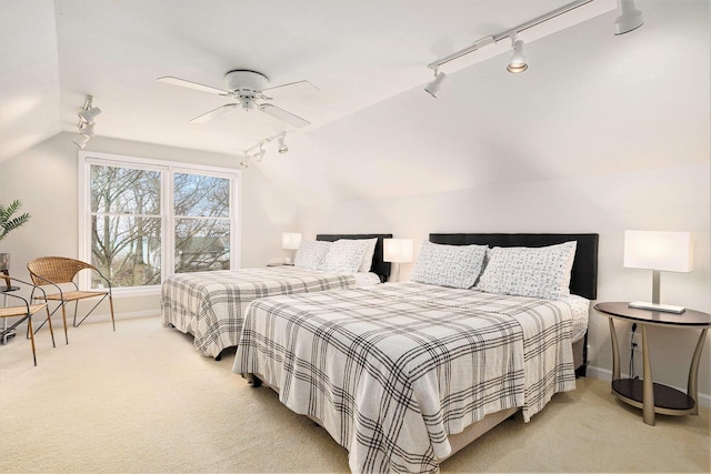 bedroom featuring ceiling fan, lofted ceiling, and light carpet