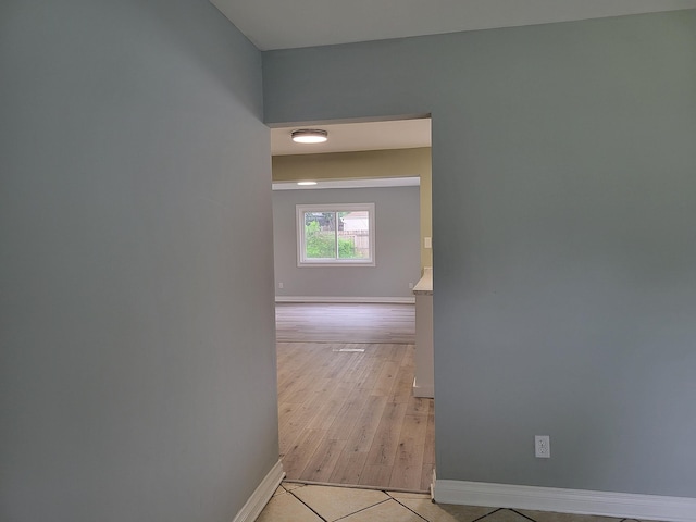 hallway with light tile patterned floors