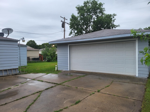 garage with a lawn