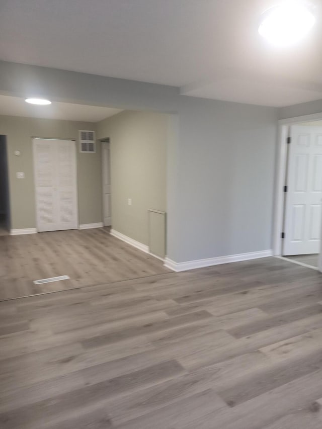 spare room featuring light hardwood / wood-style flooring