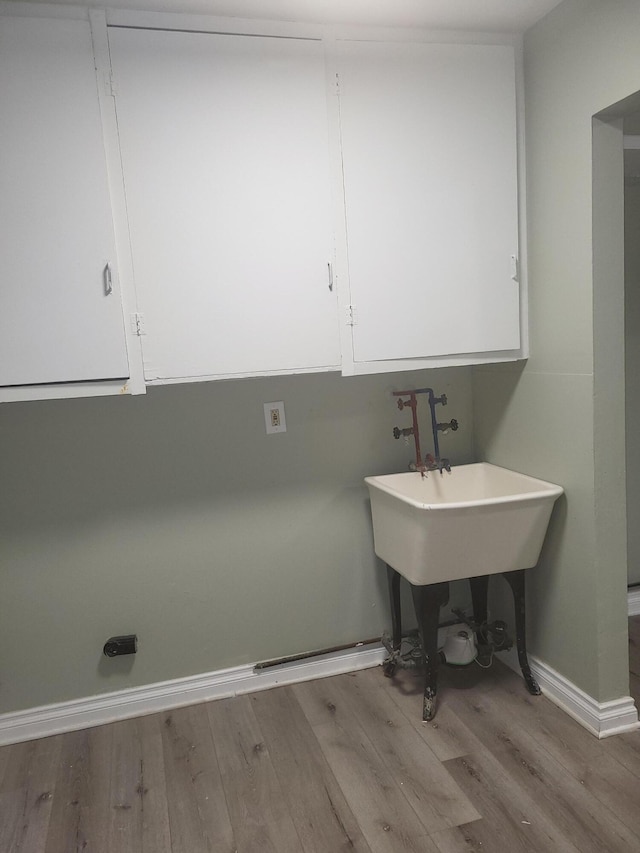 laundry room featuring light hardwood / wood-style flooring