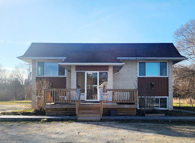 view of front facade with a wooden deck