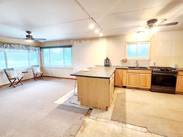 kitchen with light carpet, black gas stove, light brown cabinets, and sink