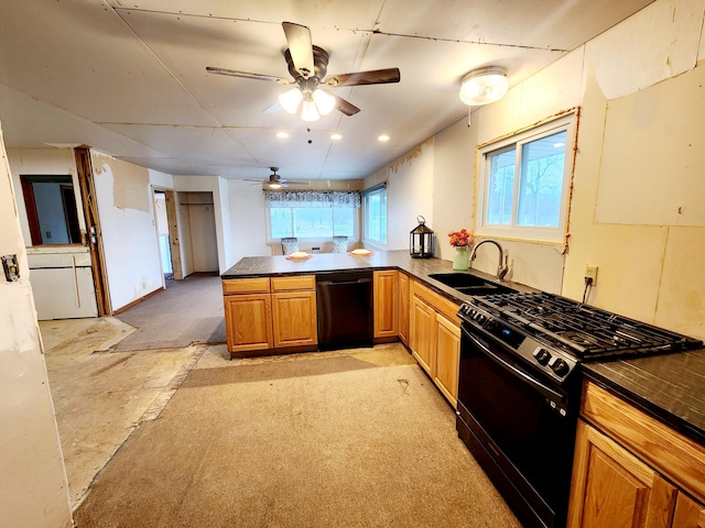 kitchen featuring kitchen peninsula, sink, ceiling fan, and black appliances