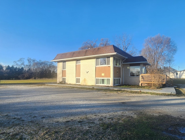 view of side of property featuring a deck