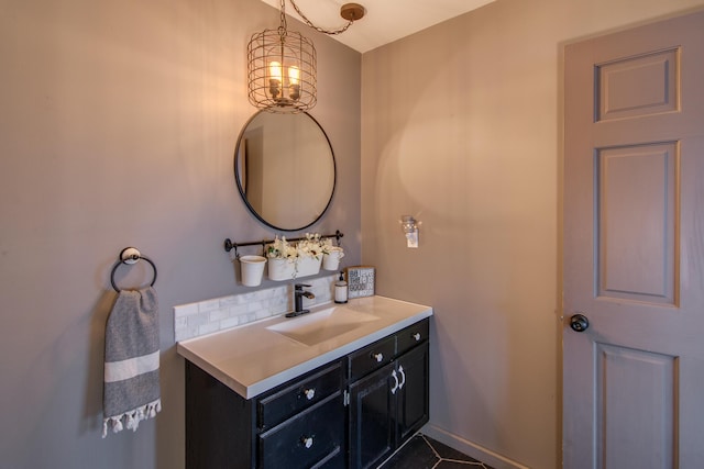 bathroom featuring decorative backsplash, tile patterned flooring, and vanity