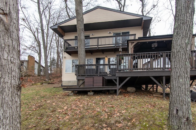 back of house featuring a balcony