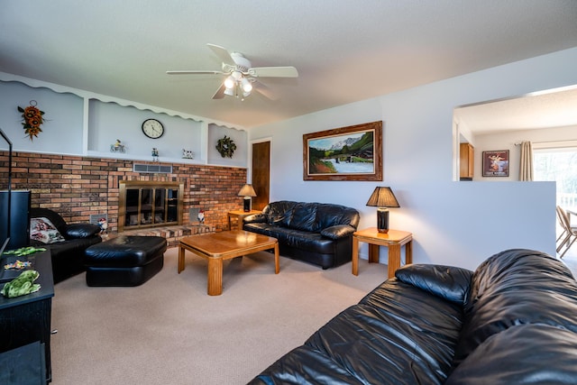 living room featuring carpet flooring, ceiling fan, built in features, and a brick fireplace