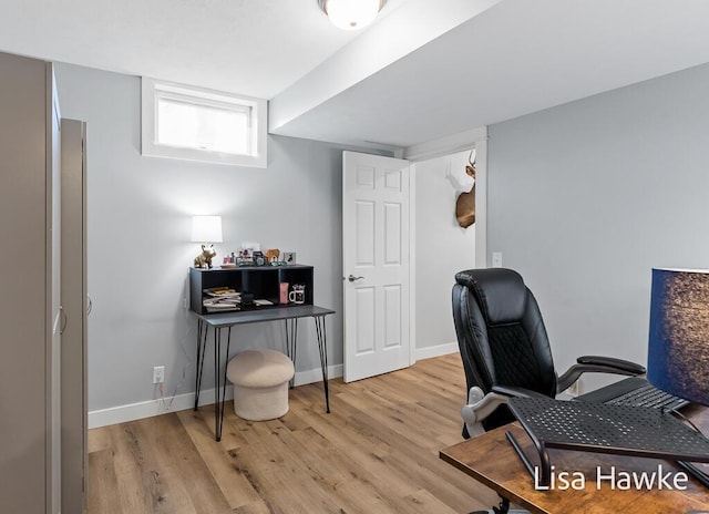 office area with light hardwood / wood-style floors