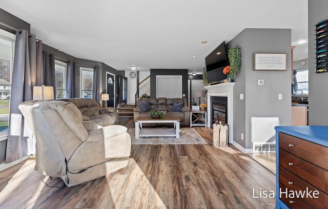 living room featuring light wood-type flooring and sink