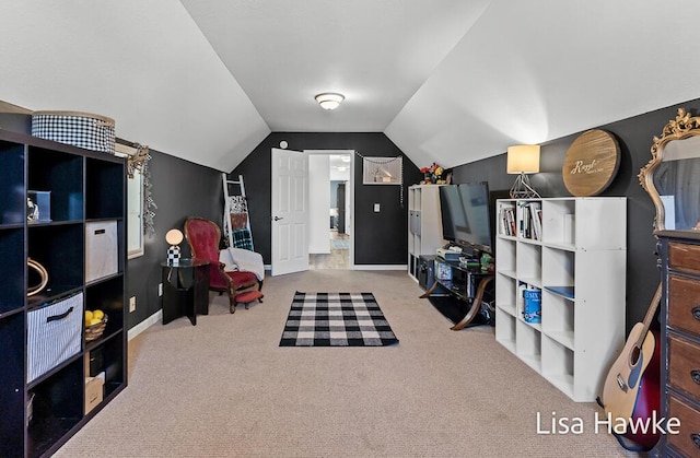 recreation room featuring carpet and lofted ceiling