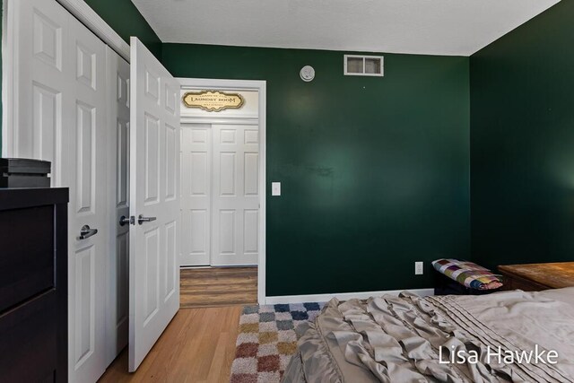 bedroom with light wood-type flooring