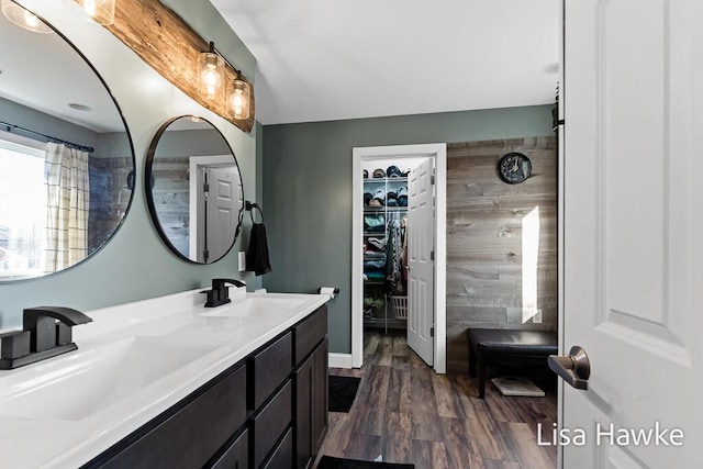 bathroom with hardwood / wood-style floors and vanity