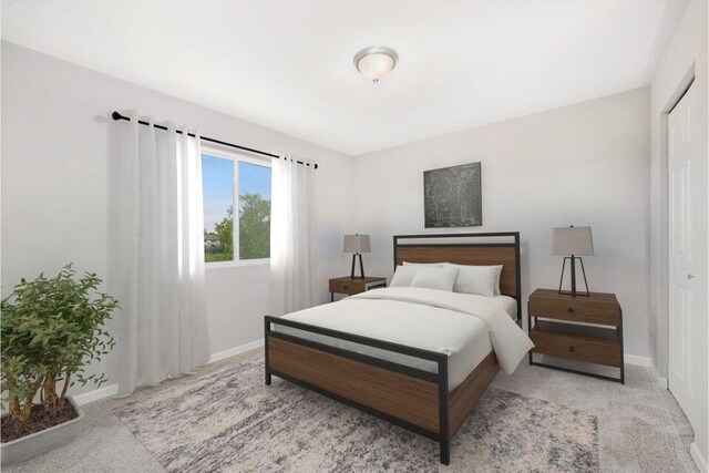 bedroom featuring light carpet and a closet