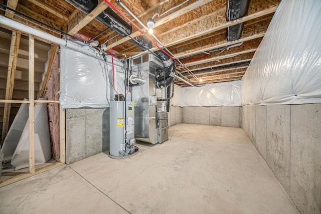 basement with water heater and heating unit