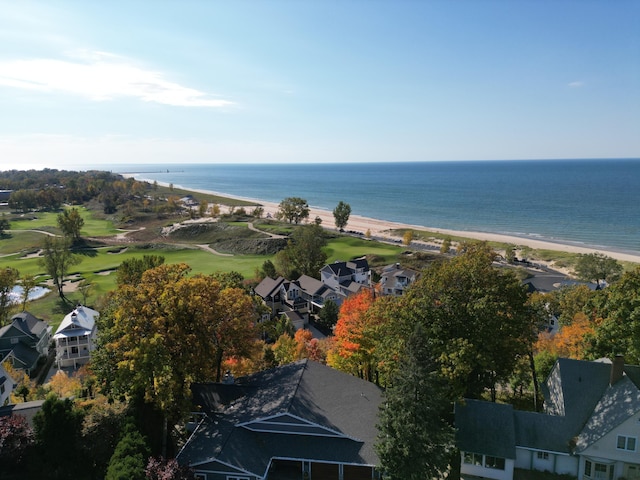 birds eye view of property featuring a water view and a view of the beach