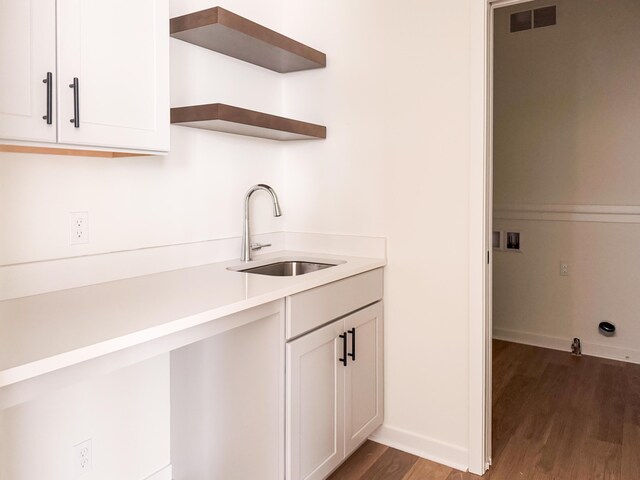 kitchen with sink and dark hardwood / wood-style floors