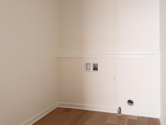 washroom featuring hookup for a washing machine and hardwood / wood-style floors