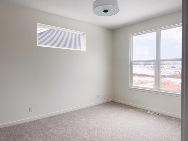 unfurnished room featuring carpet flooring