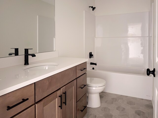 full bathroom featuring vanity, washtub / shower combination, and toilet