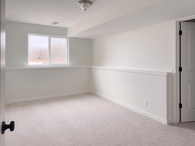 spare room with light colored carpet