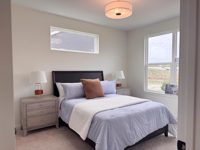bedroom with light colored carpet