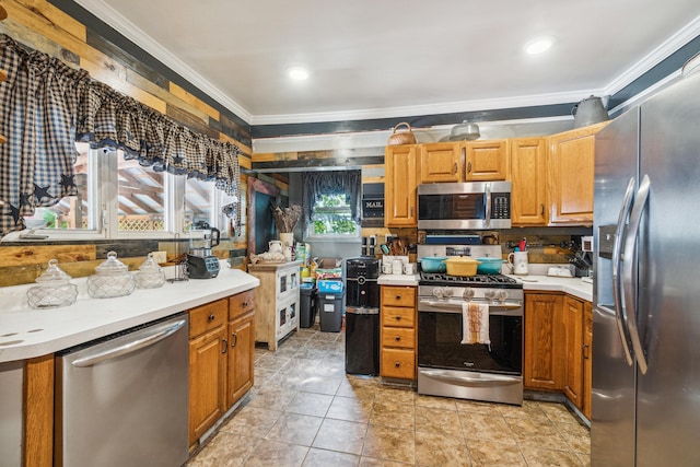 kitchen featuring stainless steel appliances and ornamental molding