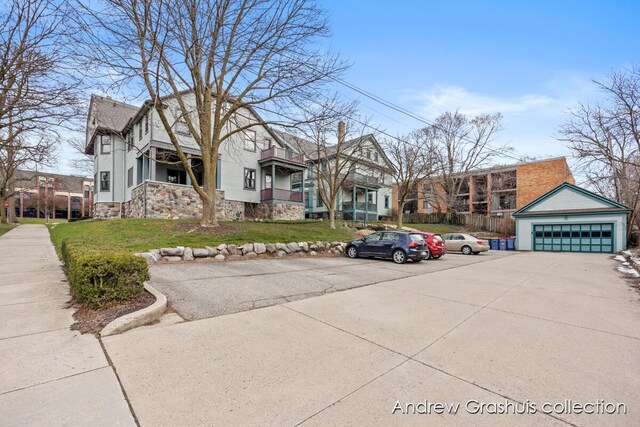 view of front of home featuring a front yard and a garage