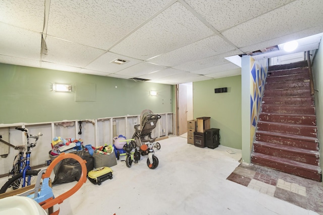 basement featuring a paneled ceiling