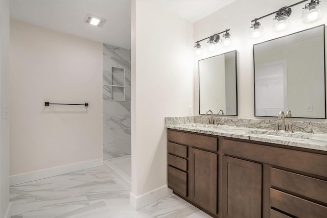 bathroom with baseboards, walk in shower, marble finish floor, a sink, and visible vents