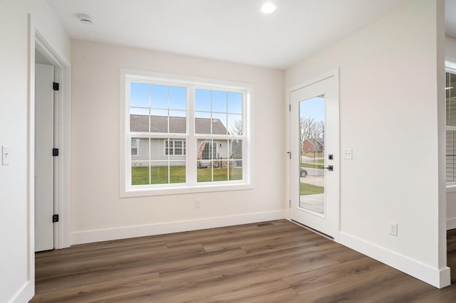 entryway featuring recessed lighting, baseboards, a healthy amount of sunlight, and wood finished floors