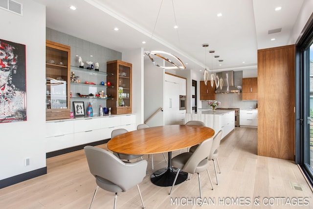 dining space featuring light hardwood / wood-style flooring